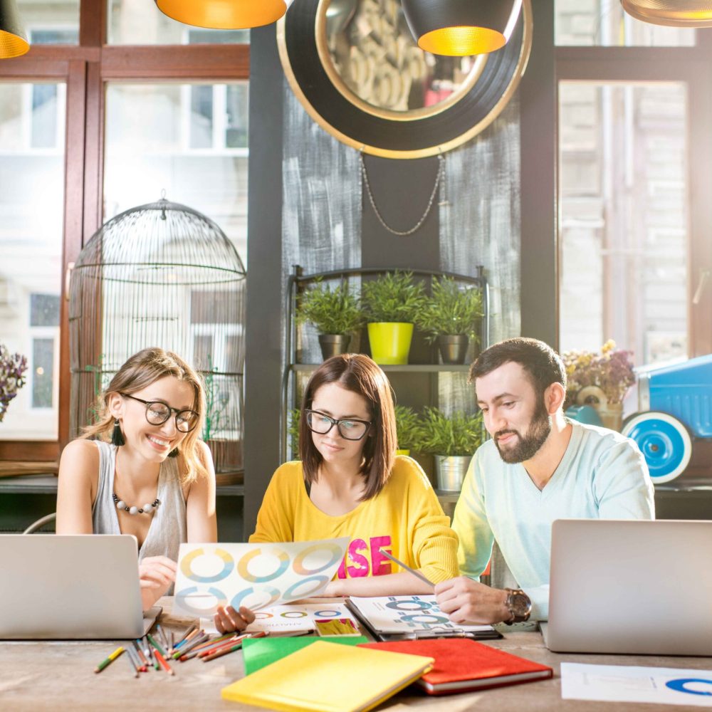 group-of-people-working-together-in-the-cafe-2023-11-27-05-18-13-utc (1)